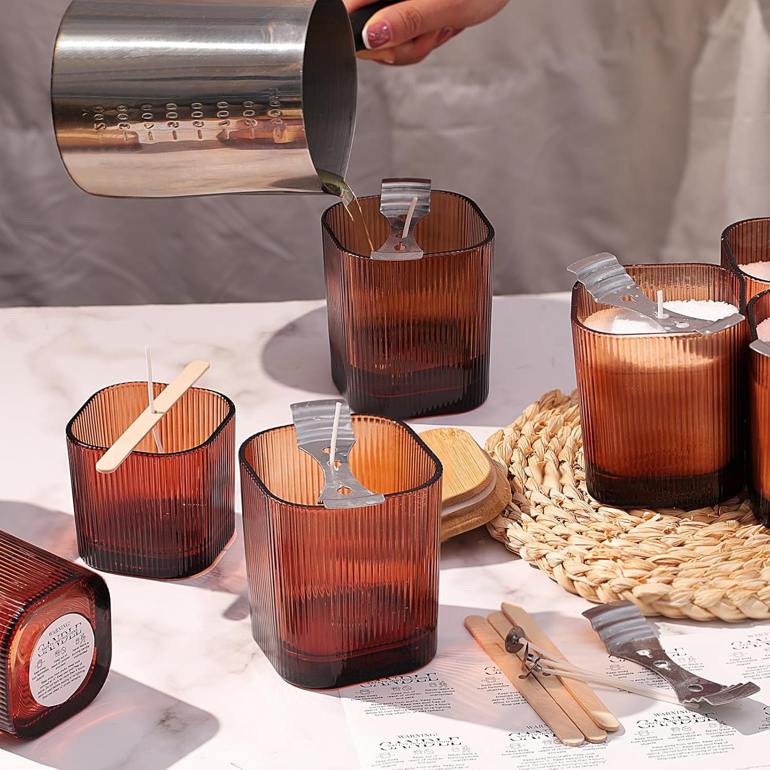 Amber ribbed glass candle vessels for candle filling