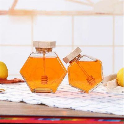 Wholesale label hexagonal fancy small empty pot can packaging bottle unique mini bee hexagon glass honey jar with wooden dipper